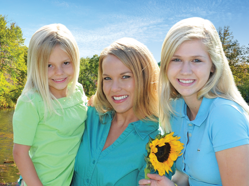 Women with kids smiling at the dentist